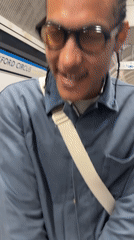 Evening commuters navigate London Underground station during routine transit