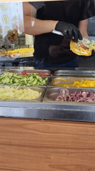Food worker prepares french fry wrap in Plovdiv