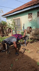 Outdoor bench press workout captured in Akwanga, Nigeria