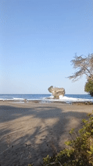 Black sand beach with rock formations, Java, Indonesia