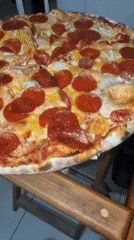 Late night pizza dinner documented in Cholula, Mexico