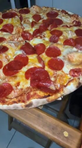 Late night pizza dinner documented in Cholula, Mexico