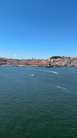 Lisbon skyline seen from the Tagus River on a sunny afternoon