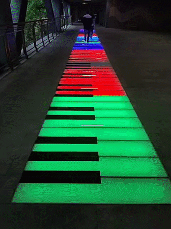 Illuminated piano walkway attracts pedestrians in Yuzhong District