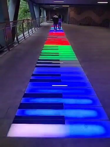 Illuminated piano walkway attracts pedestrians in Yuzhong District