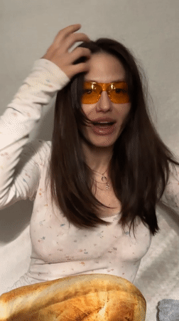 Woman records video message in Murino, Russia