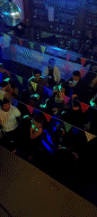 Social gathering with DJ documented at Arica venue