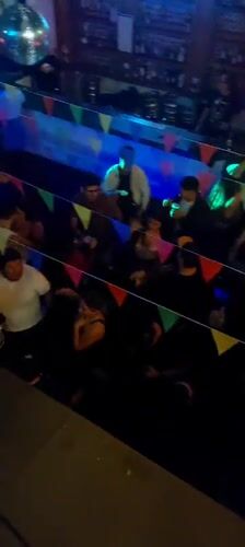 Social gathering with DJ documented at Arica venue