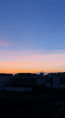 Colorful sunset observed over Mengwi residential area with mountain backdrop