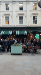 Crowd gathers at London pub near molecular art installation