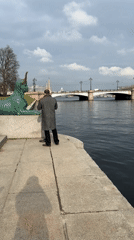 Tourists visit sphinx statues along Saint Petersburg waterfront