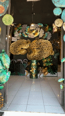 Art gallery interior documented in Tegallalang, Indonesia features metalwork, carvings