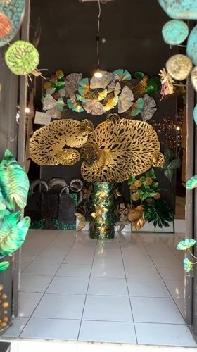 Art gallery interior documented in Tegallalang, Indonesia features metalwork, carvings