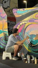 Mural painting, street performance, and moon-gazing in Tel Aviv