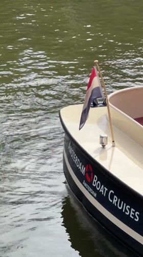 Everyday Amsterdam scenes captured during midday tourist activity