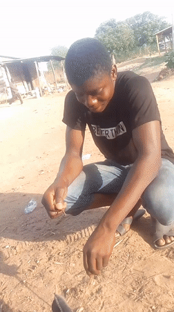 Children play near water facilities in Adankolo, Nigeria