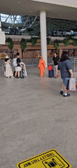 Flight crew and monk observed at Kuta airport terminal