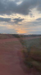 Train passenger films countryside fields near Castellbisbal, Spain