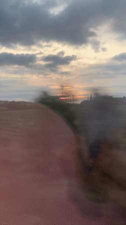 Train passenger films countryside fields near Castellbisbal, Spain