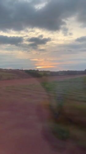 Train passenger films countryside fields near Castellbisbal, Spain