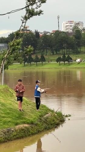 Young anglers fish muddy waters in Da Lat