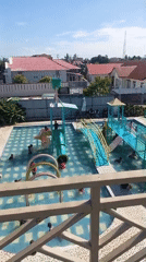 Families enjoy sunny day at Lhokseumawe water park