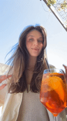 Tourist enjoys afternoon drinks and sightseeing in Budva's old town