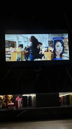 Television broadcasts romantic scene in Vologda bookstore setting