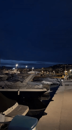 Marina boats docked at night in Cannes, France
