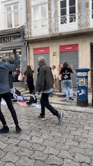 Street life and architecture across central Porto on a June afternoon