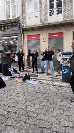 Street life and architecture across central Porto on a June afternoon