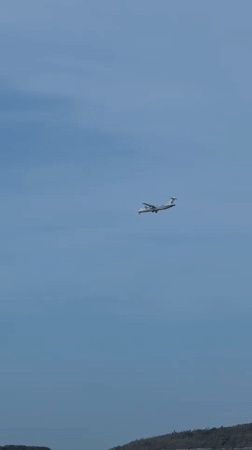 Plane on approach, quiet beaches below — Ko Samui morning