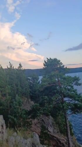 Clifftop views and pine trees along Lake Turgoyak's shoreline