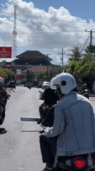 Scooter ride documented on Denpasar roads during early morning hours
