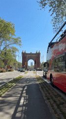 Clear day at Barcelona's Arc de Triomf draws pedestrians