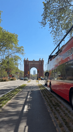 Clear day at Barcelona's Arc de Triomf draws pedestrians