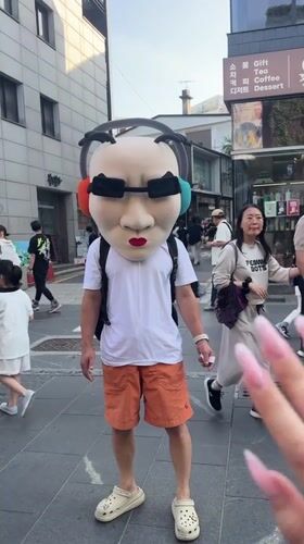 Masked street performer spotted in Seoul wearing distinctive costume