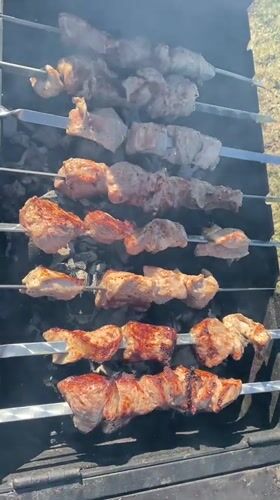 Outdoor grilling and aircraft contrail observed in Malyi Bukor