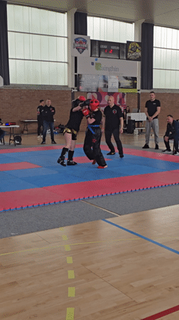 Youth kickboxing match held in French gymnasium