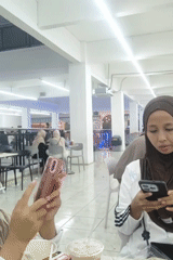 Midday at a Sintang supermarket with a food court area
