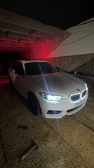 BMW with underglow lights documented in Arica garage