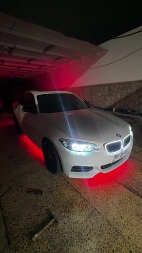 BMW with underglow lights documented in Arica garage