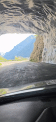 Driver captures tunnel exit and mountain lake views in Benasque