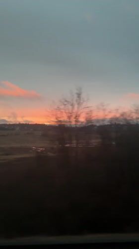 Sunset observed over wet field near Dedenevo, Russia
