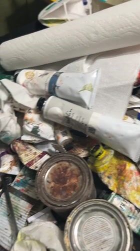 Artist's cluttered workspace documented in Cape Coral