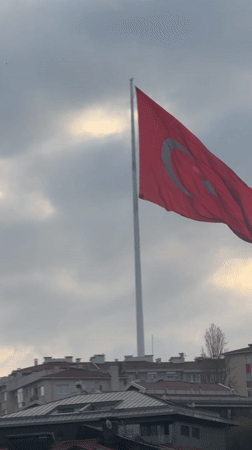 Turkish flag waves in early morning winds in Istanbul