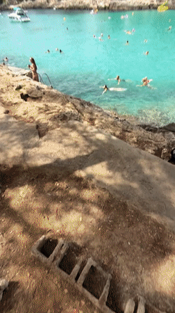 Crowded summer beach day at Cala D'or, Spain