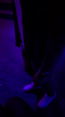 Evening observations capture person in blue-lit room, purple flowering plant