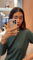 Woman takes selfies on Paris street Thursday morning