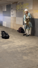 Costumed saxophonist performs in Riga tunnel amid local food displays